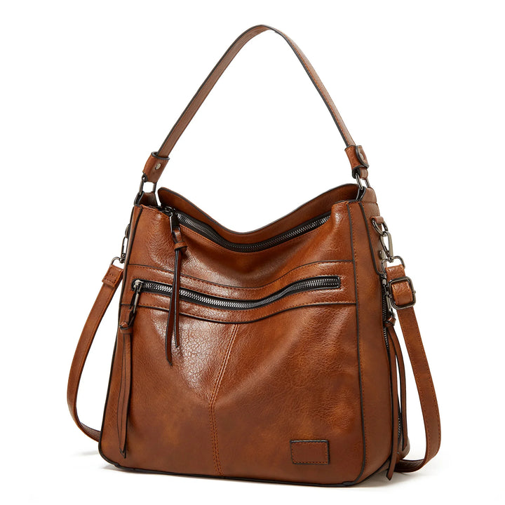 brown leather handbag with dual zippered pockets and adjustable shoulder strap