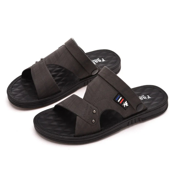 Black casual men's slide sandals with adjustable straps and textured footbed on white background