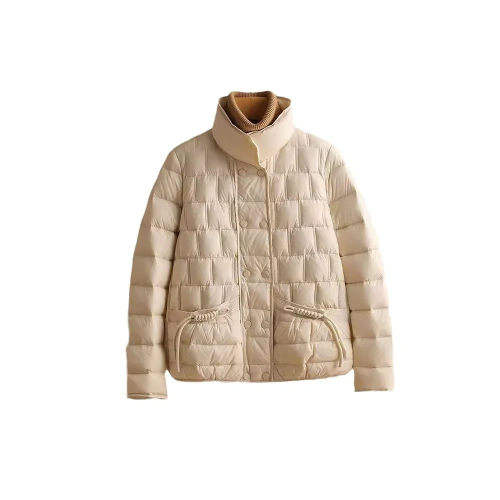 Beige quilted puffer jacket with high collar and front pockets on white background