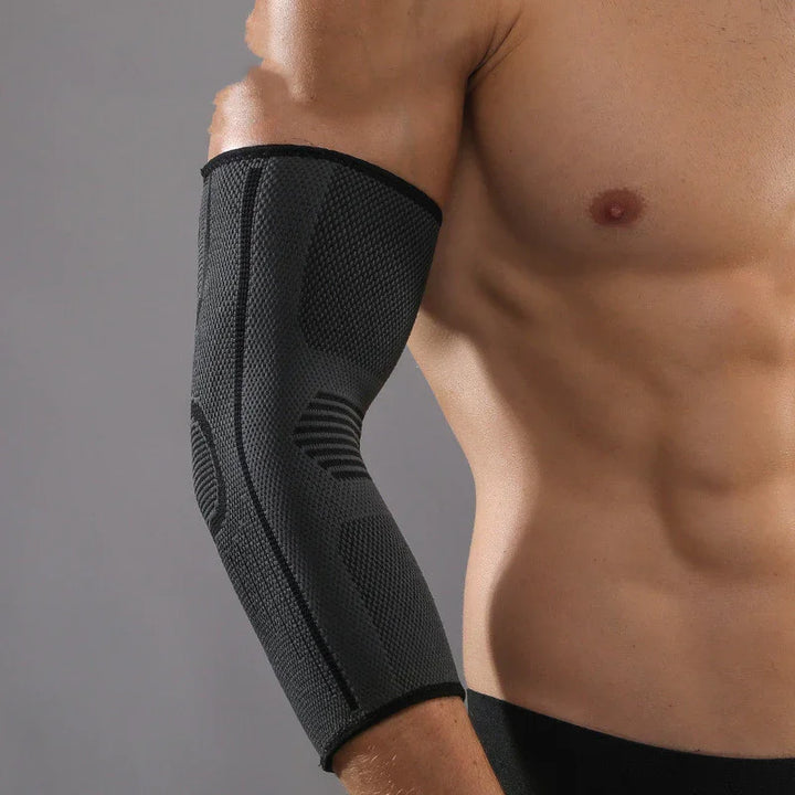 Man wearing black compression elbow sleeve support for arm and elbow injury