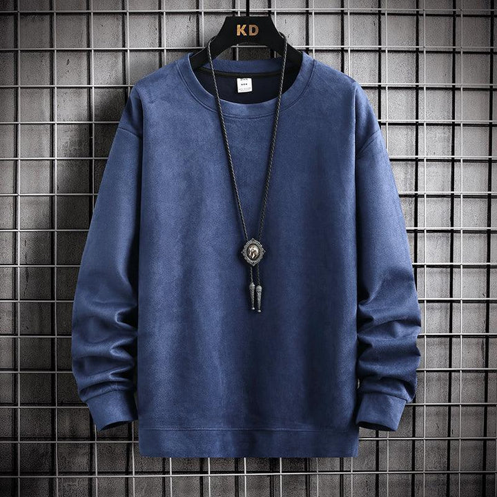 Blue long-sleeve crewneck sweatshirt hanging on KD hanger with black pendant necklace against metal grid wall