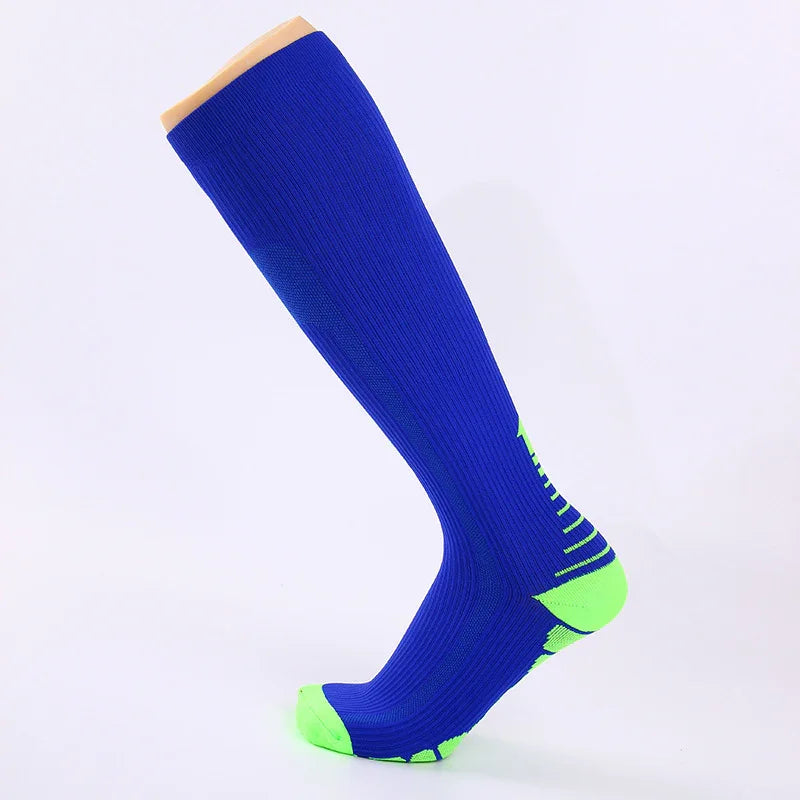 Blue knee-high sports sock with neon green heel and toe on display