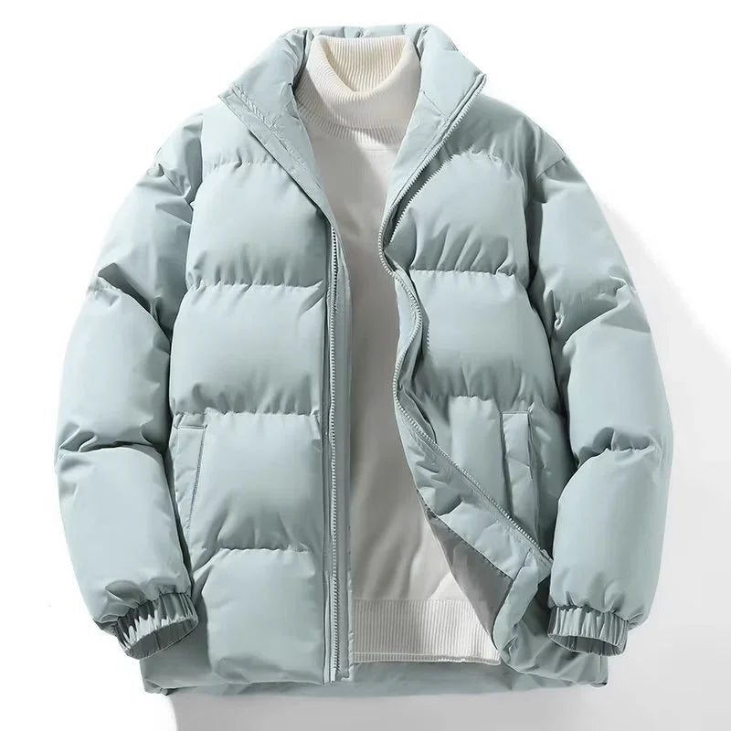 Light blue puffer jacket with front zipper over white turtleneck sweater on white background