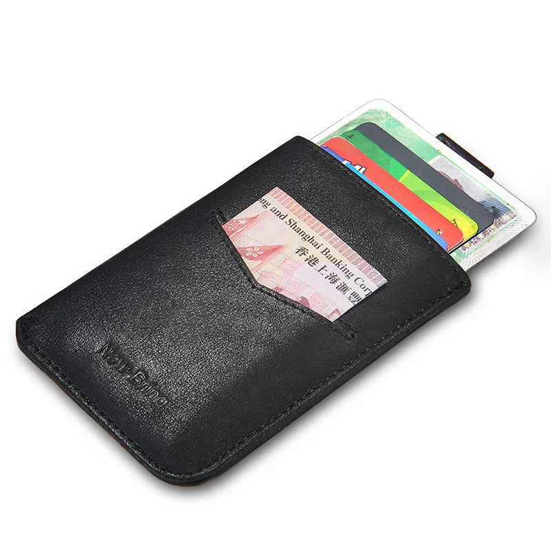 Black leather slim card holder wallet with various credit cards and a banknote partially visible