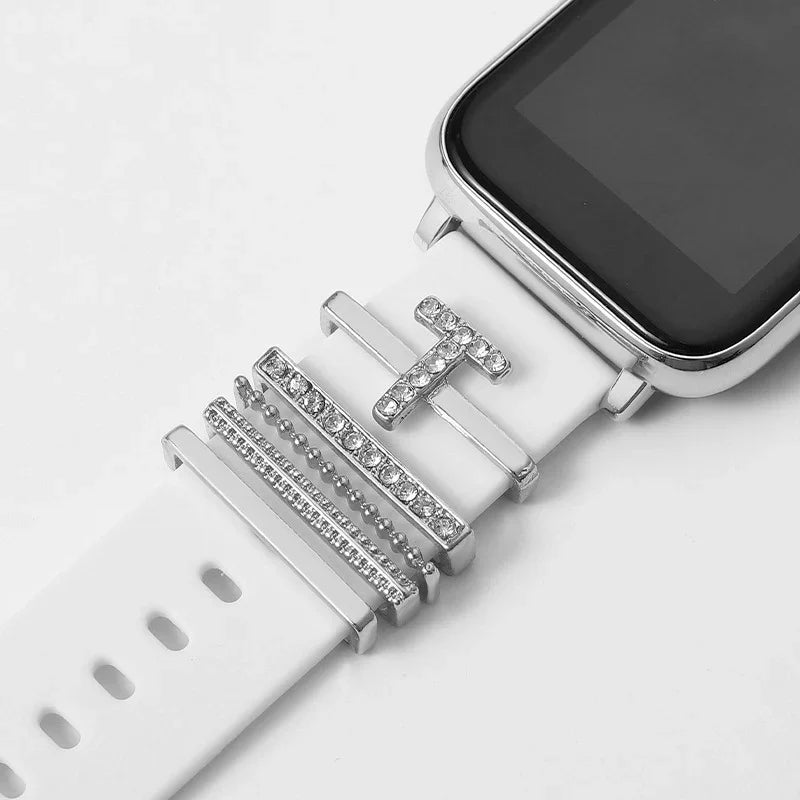 white smartwatch with silver and rhinestone decorative letter T and bar charms on band