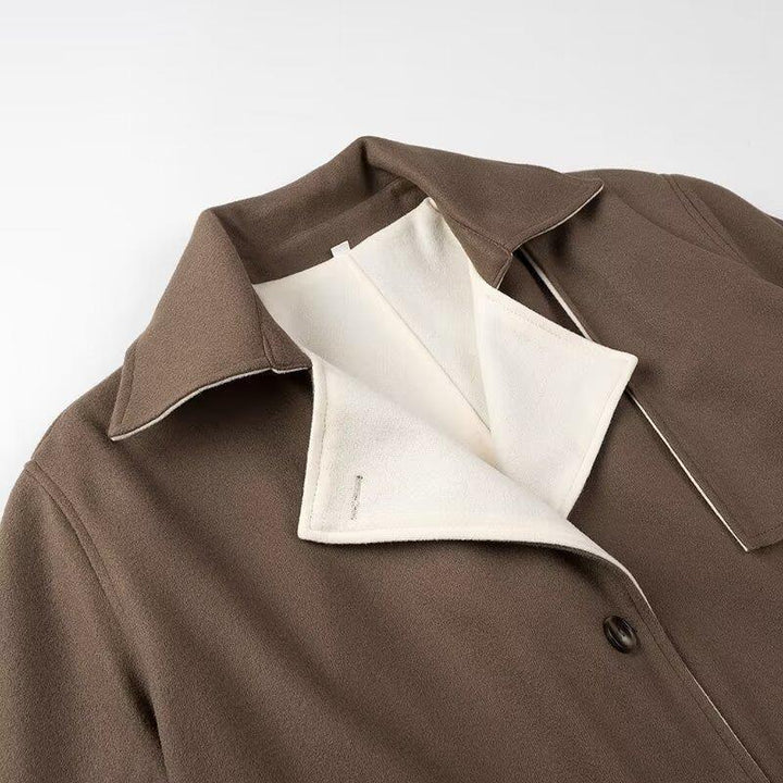 brown coat with white inner lining and collar detail on plain background
