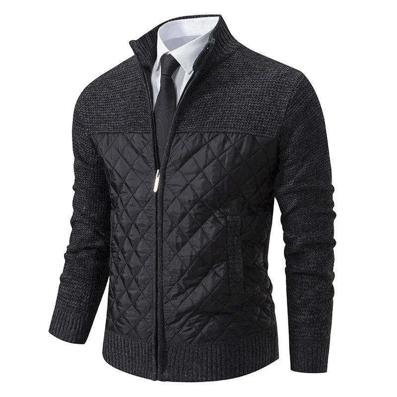 Men's black quilted and knitted zip-up jacket over white shirt and black tie