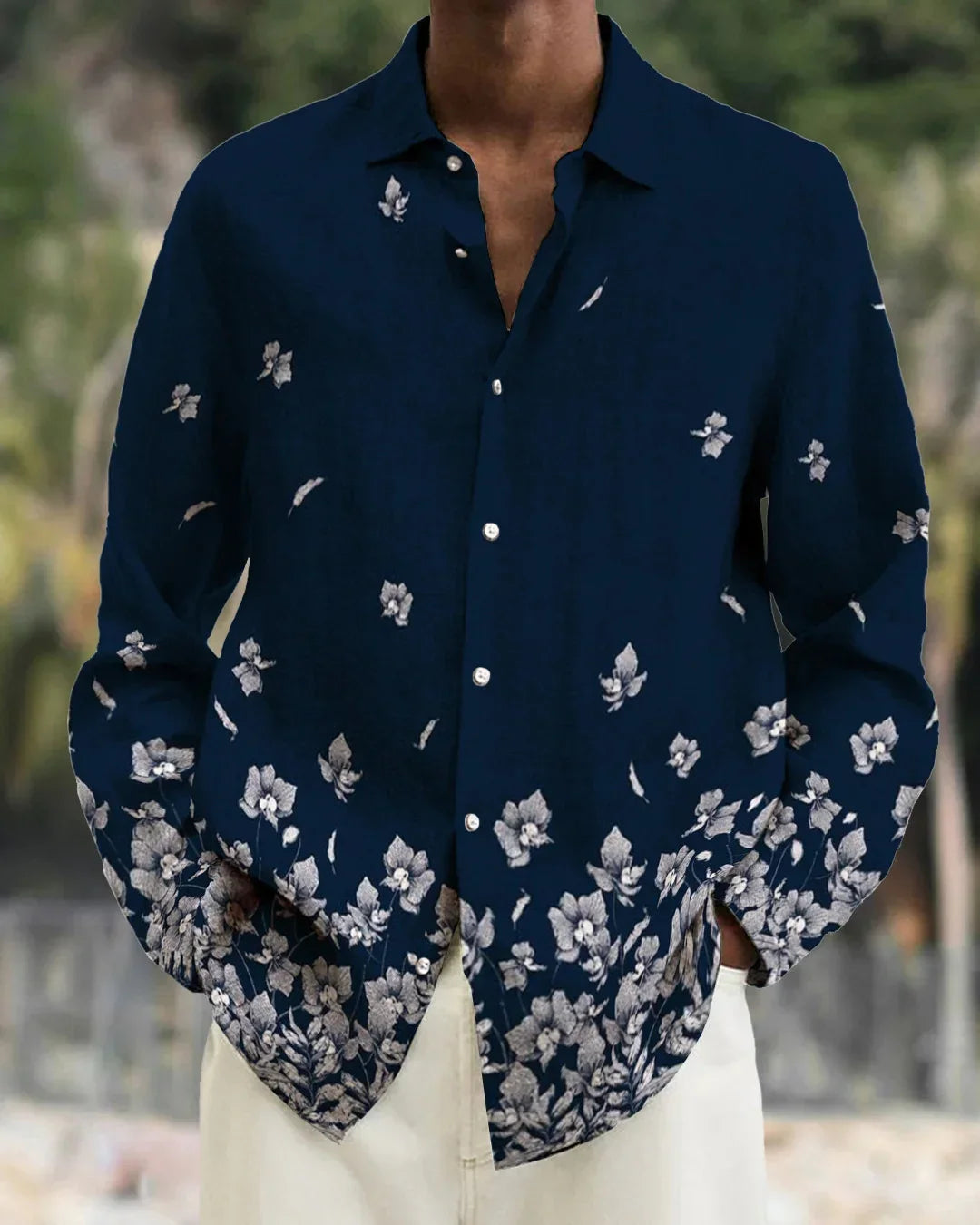 Men's navy blue button-up shirt with white floral print on lower half and sleeves