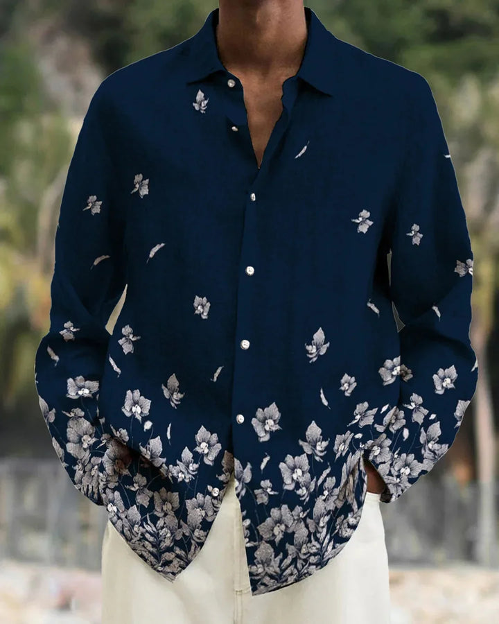 Men's navy blue button-up shirt with white floral print on lower half and sleeves