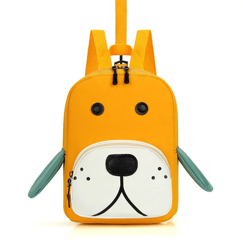 Yellow kids backpack with dog face design, black eyes and nose, white front pocket, green ears