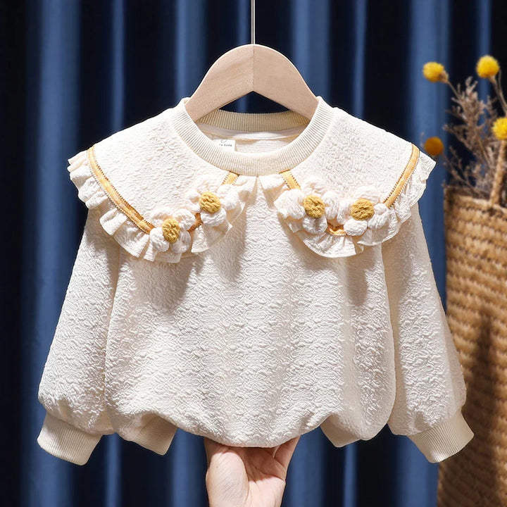 Cream textured baby sweater with ruffled collar and yellow white flower embroidery