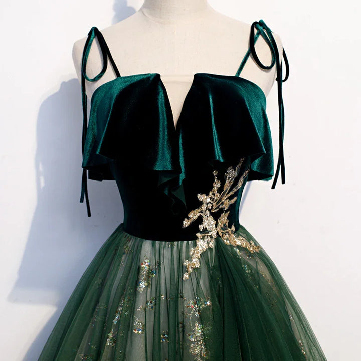 Elegant dark green velvet evening dress with gold floral embroidery and tulle skirt