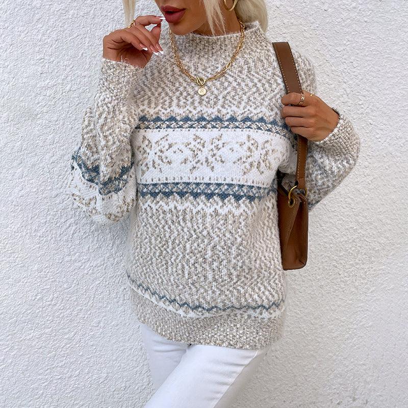 Woman wearing cozy fair isle knit sweater in neutral tones with gold jewelry and brown shoulder bag