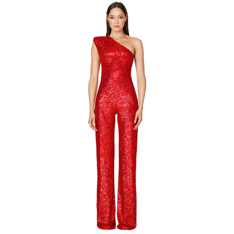 Woman wearing red sequin one-shoulder jumpsuit with wide-leg pants on white background