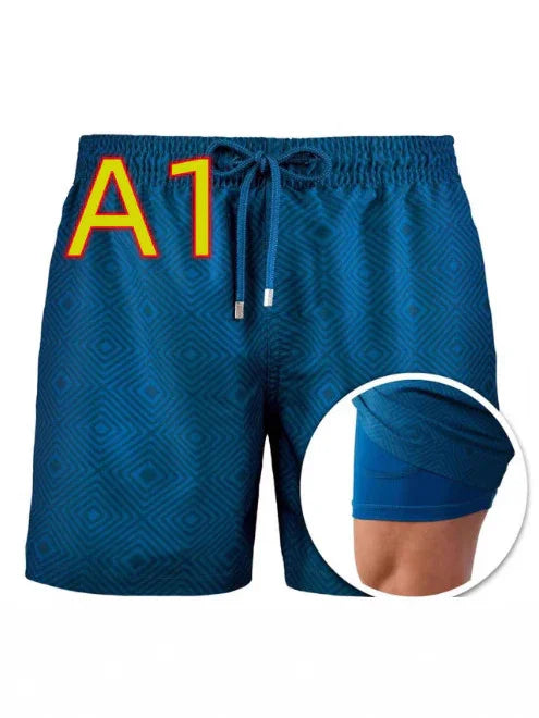 Blue patterned men's swim trunks with inner compression shorts and adjustable drawstring