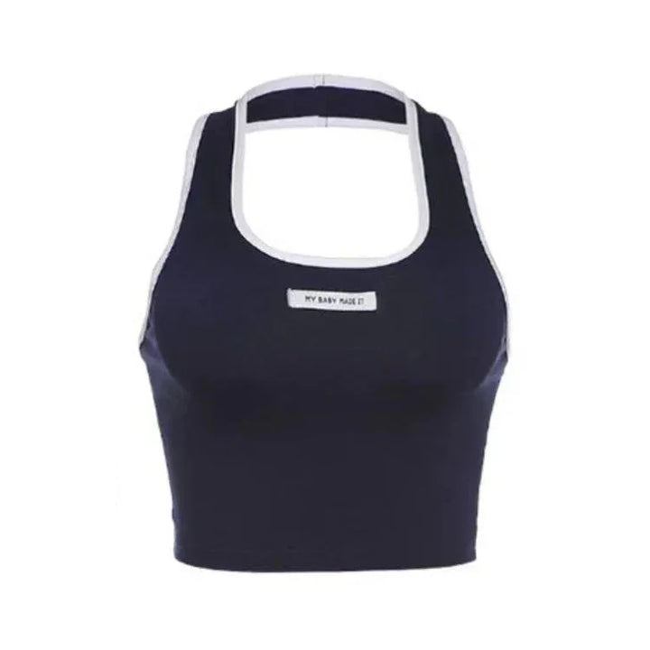 Navy blue sports bra with white trim and a label reading 'MY BABY MADE IT' on front