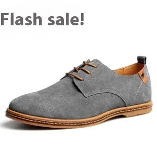 Gray suede men's dress shoe with brown laces and sole, advertising flash sale