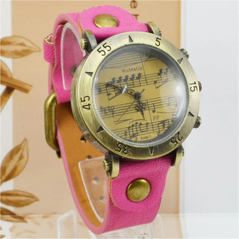 Vintage brass wristwatch with musical notes dial and pink leather strap with brass studs