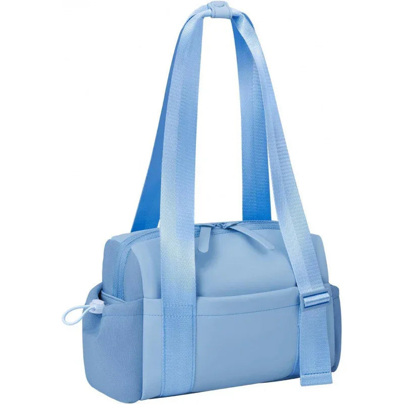 Light blue compact shoulder bag with adjustable straps and zippered compartments