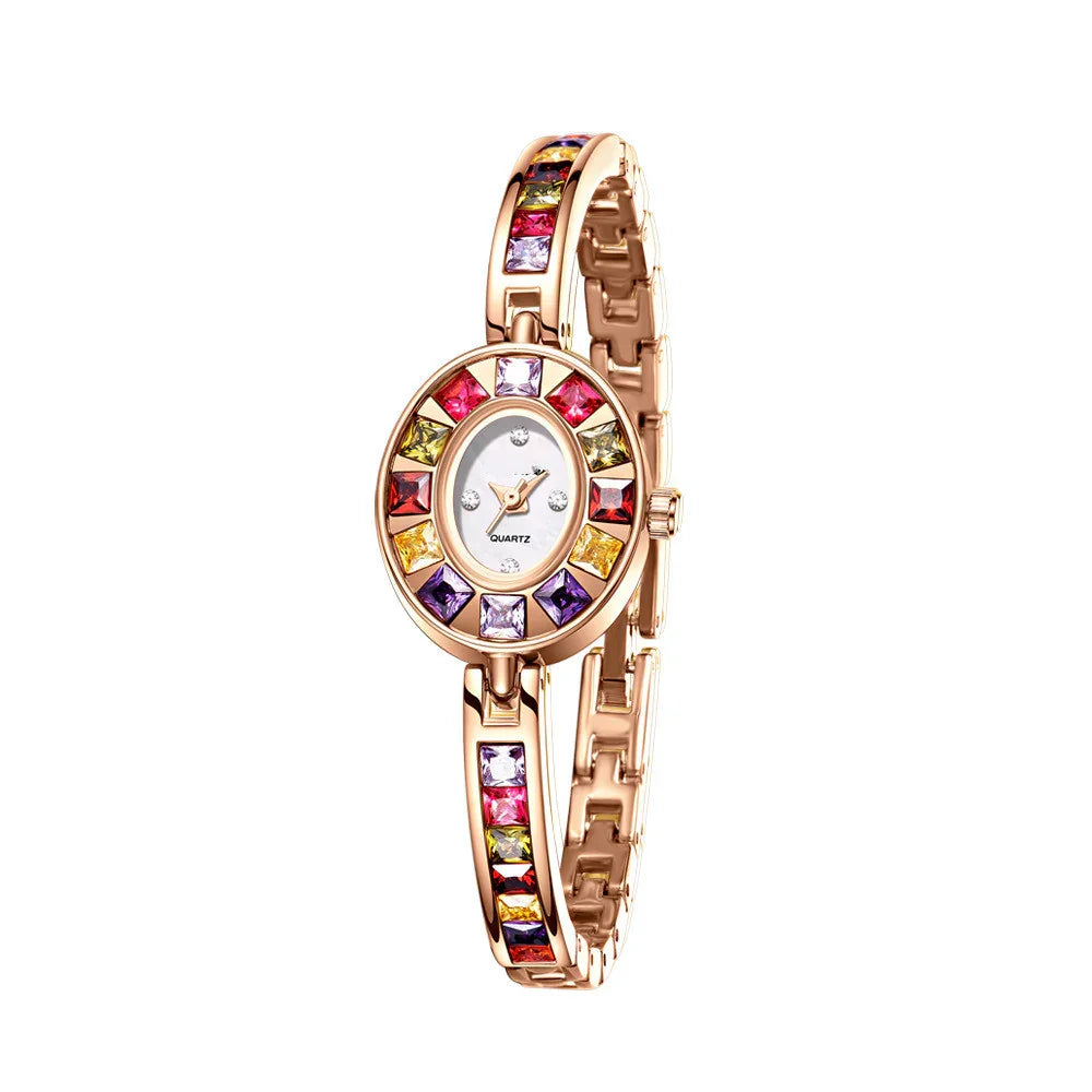 Elegant rose gold wristwatch with multicolored square gemstones on bezel and bracelet