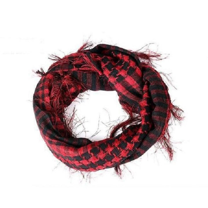 Red and black checkered scarf with fringed edges on white background