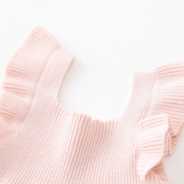 Soft pink ribbed knit top with ruffled sleeves on white background
