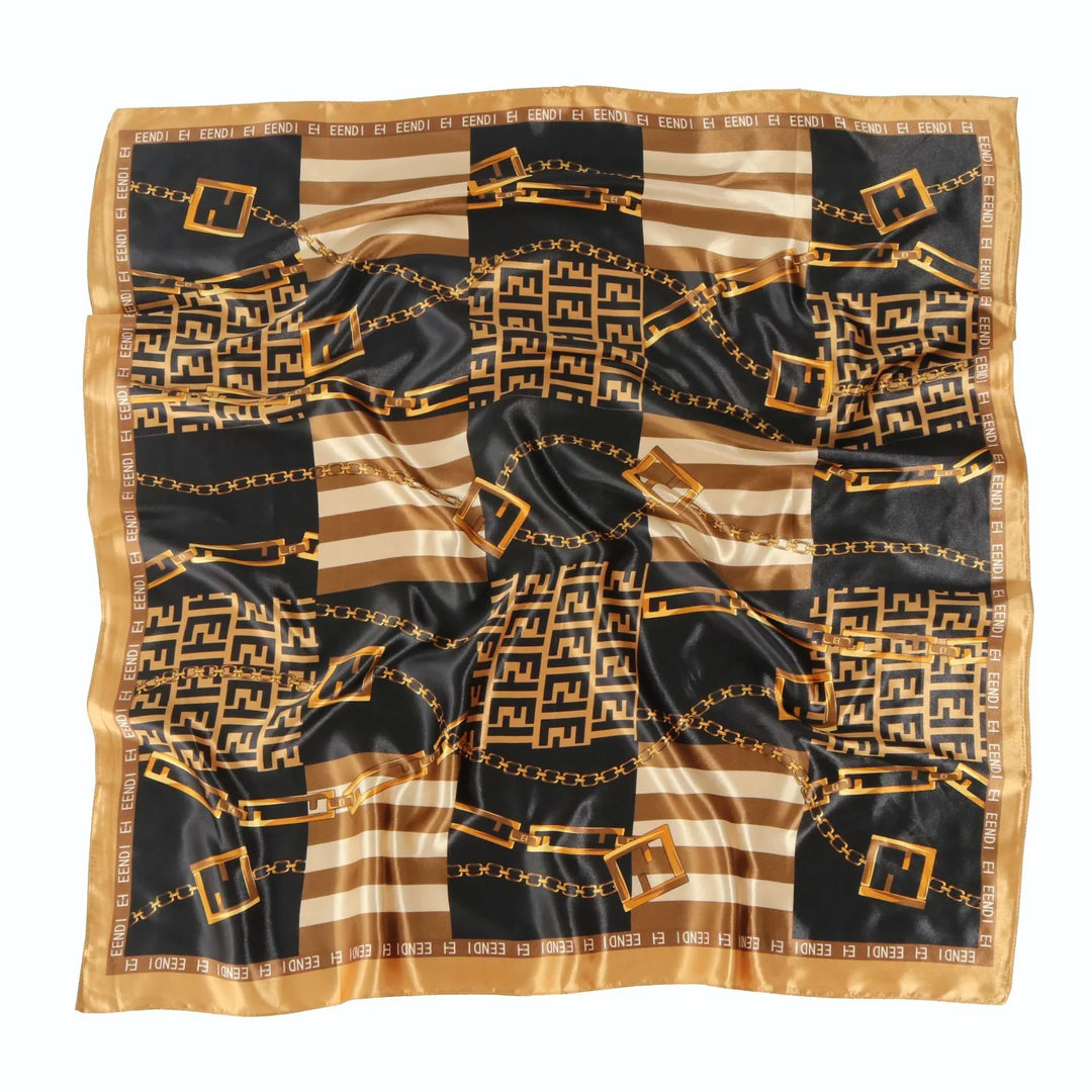 Luxury black and gold patterned silk scarf with chain and logo design