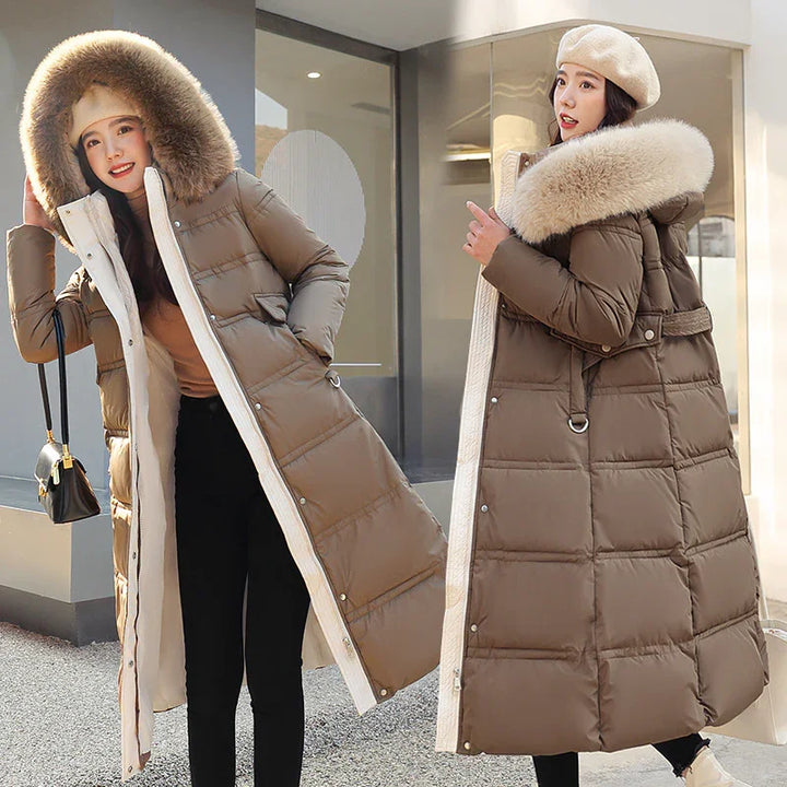 Women modeling long brown winter puffer coats with fur hoods and beige berets outdoors