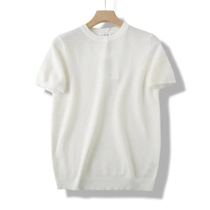White short-sleeve knit sweater with textured pattern on wooden hanger