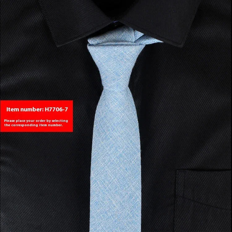 Light blue textured necktie on black dress shirt with collar and pocket, item number H7706-7