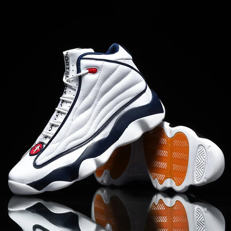 White and navy high-top sports sneakers with orange grip soles on black reflective surface