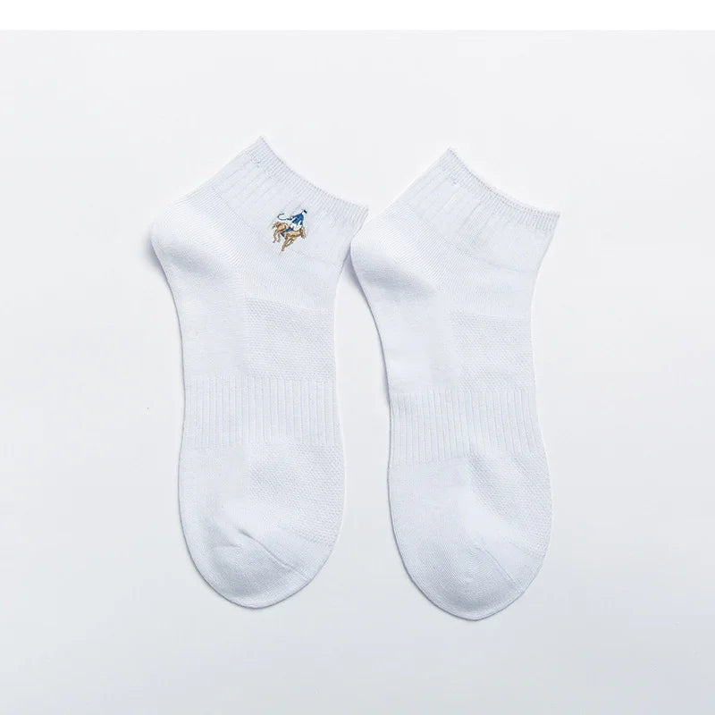 Pair of white ankle socks with embroidered blue and brown bear logo on one side
