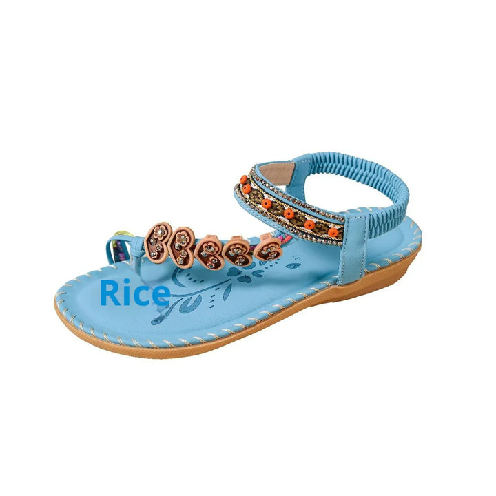 Blue leather women's sandal with floral embroidery and decorative orange beads on ankle strap