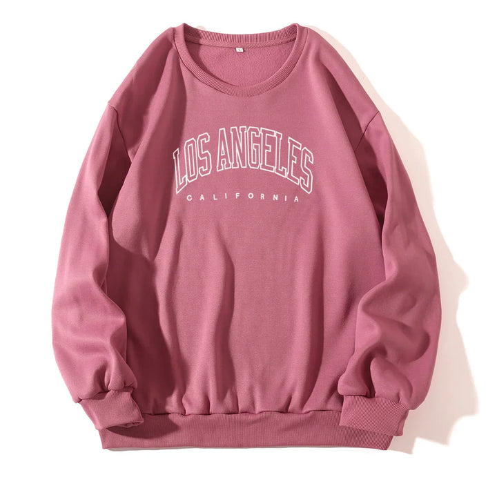 Pink crewneck sweatshirt with Los Angeles California white text print, ribbed cuffs and hem