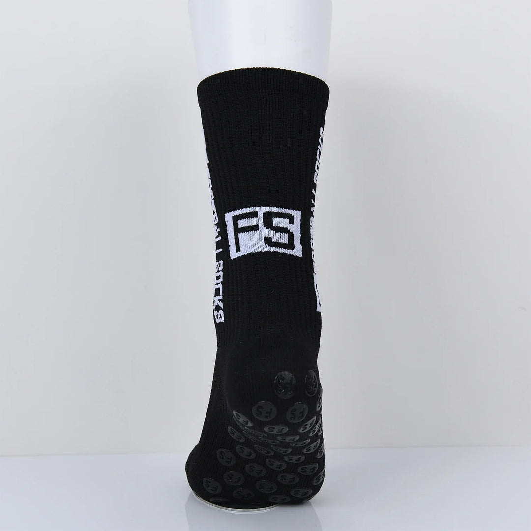 Black grip socks with white FS logo and text on side, displayed on white mannequin foot