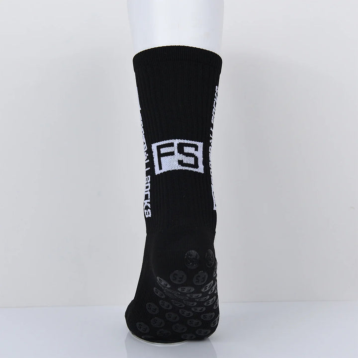 Black grip socks with white FS logo and text on side, displayed on white mannequin foot