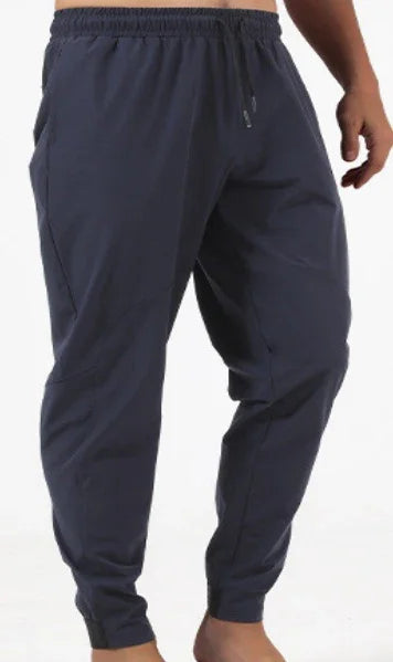 men's navy blue jogger pants with elastic waistband and tapered ankles