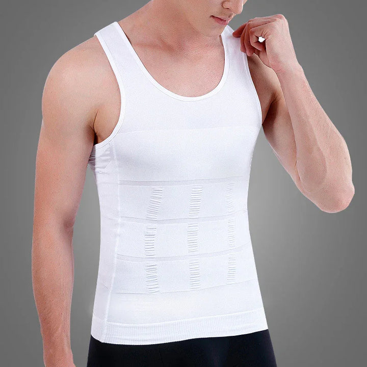 man wearing white sleeveless compression shirt with textured abdominal panels on gray background