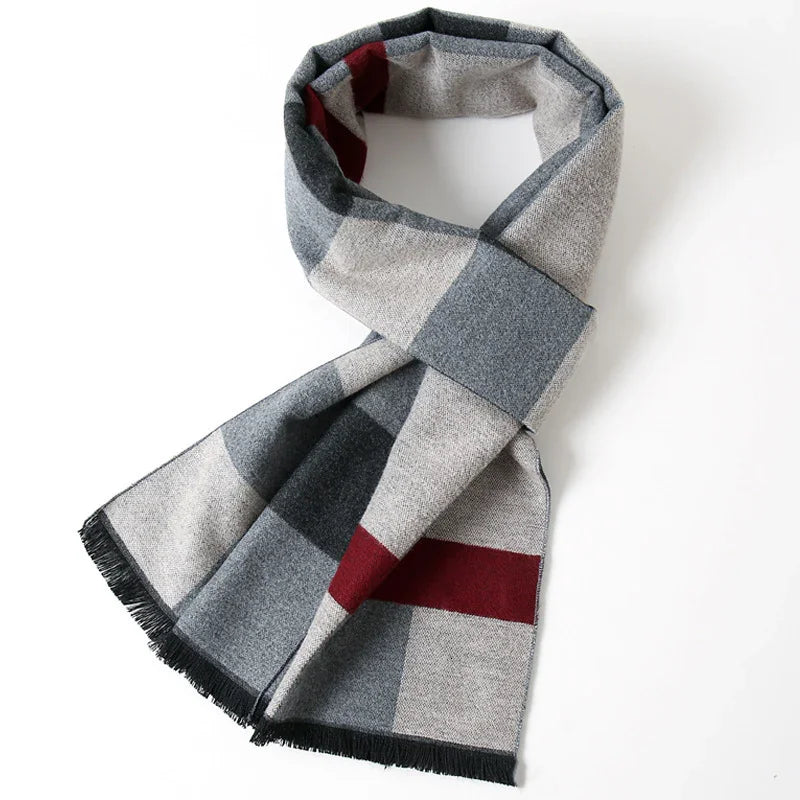 Checked wool scarf in gray, black, and burgundy with fringe edges on a white background
