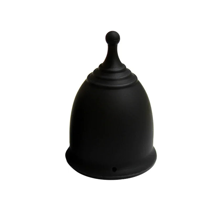 Black silicone menstrual cup with a rounded top and grip stem, isolated on white background