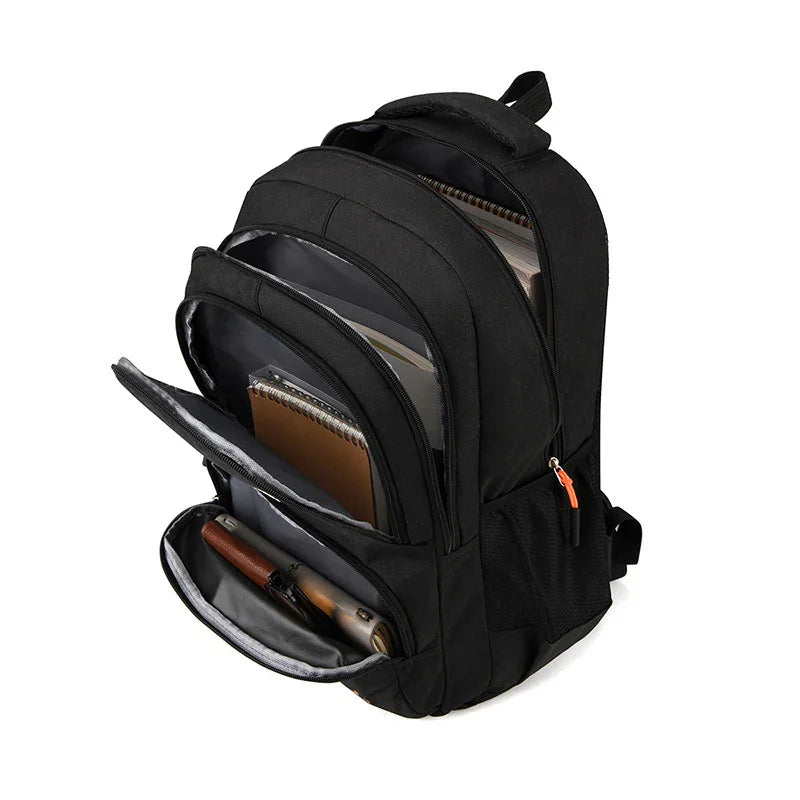 Black multi-compartment backpack open showing notebooks, pens, and organized storage for school or office