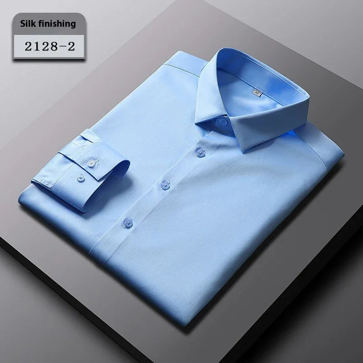 Light blue men's dress shirt with silk finishing, neatly folded on gray background