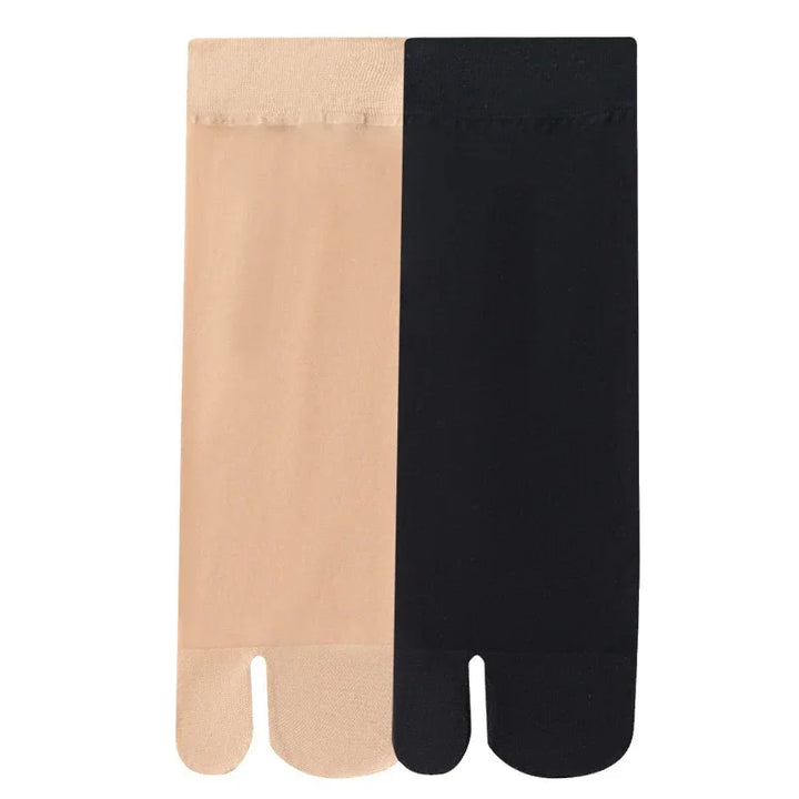 Pair of beige and black split-toe socks with smooth texture on white background