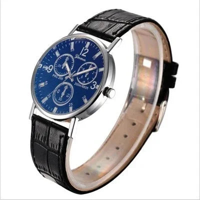 Elegant men's wristwatch with blue dial, silver case, chronograph subdials, and black leather strap