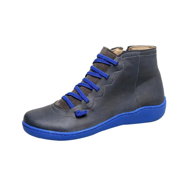 dark gray leather high-top shoe with bright blue laces and blue sole on white background