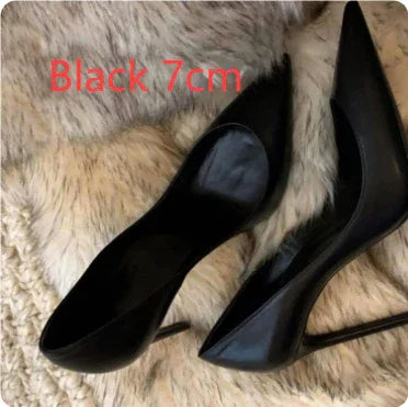 pair of black 7cm high-heeled pointed toe shoes on beige fur surface
