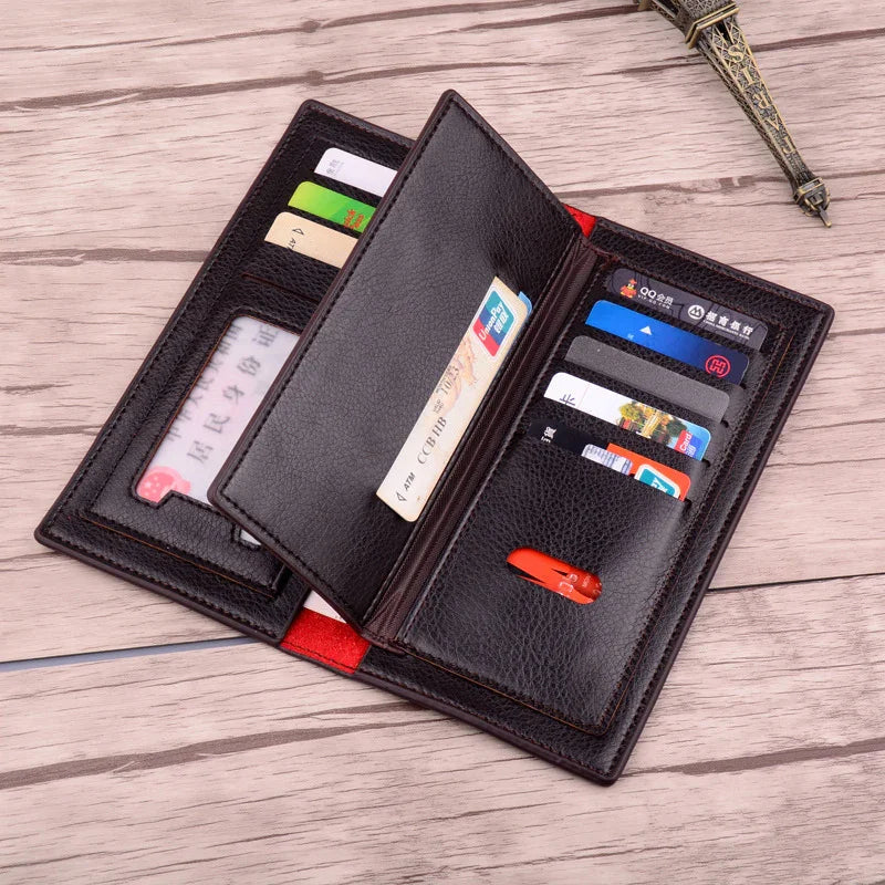 Open black leather wallet with multiple credit cards and ID cards on wooden surface
