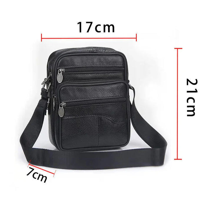 Black leather crossbody bag with multiple zippered compartments and adjustable strap, dimensions 21x17x7 cm