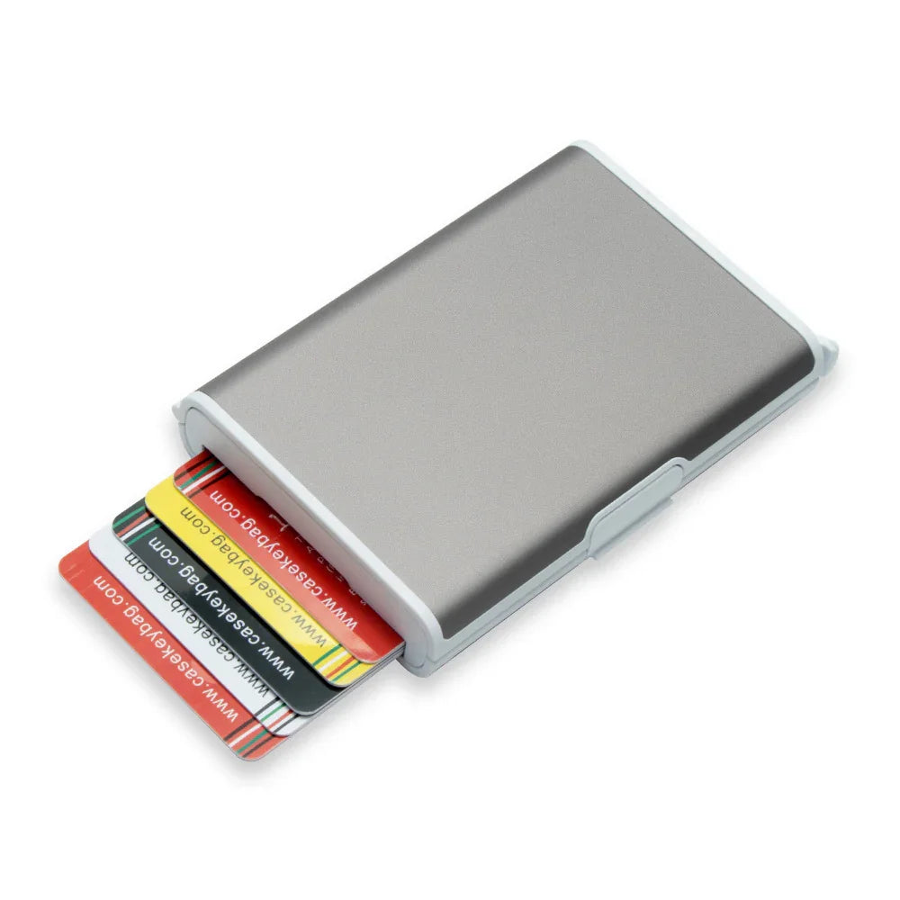 metal cardholder wallet with multiple colorful cards partially inserted, isolated on white