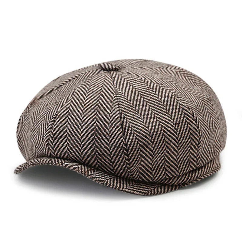 brown and beige herringbone patterned newsboy cap with small brim on white background